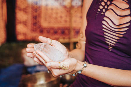 woman holding crystal, crystal in womans hand.の写真素材