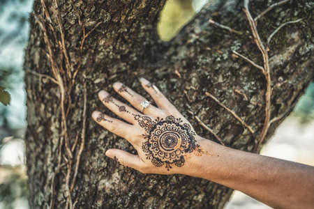 Henna art on womans hand.の写真素材