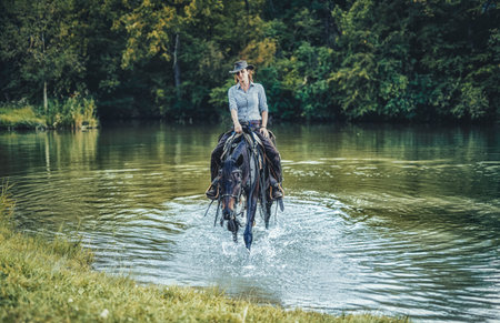 Young beautiful dreadded girl outdoors with her true horse.
