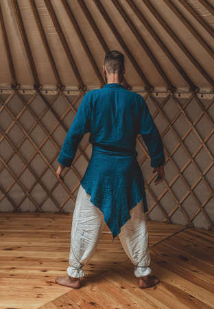 dancing warrior, ceremonial dance in a yurt.の写真素材