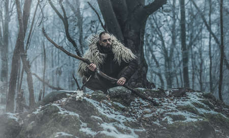 Shamanic man in the nature, winter landscape.の写真素材