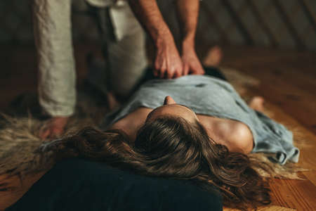 Masseur doing massage on woman body. Beauty concept.の写真素材
