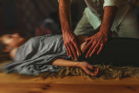 Masseur doing massage on woman body. Beauty concept.の写真素材