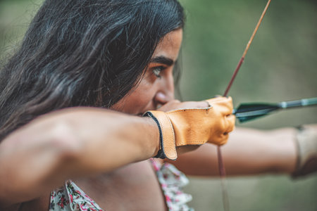 detail of a woman training shooting with a bow.の写真素材