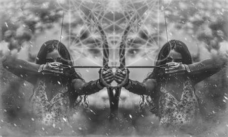 woman training shooting with a bow and merkaba.の写真素材