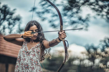 detail of a woman training shooting with a bow.の写真素材