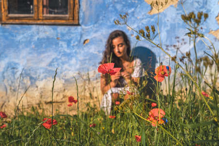 Exotic woman on the farm with flowers.の写真素材