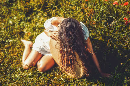 beautiful shamanic girl playing on shaman frame drum in the nature.の写真素材