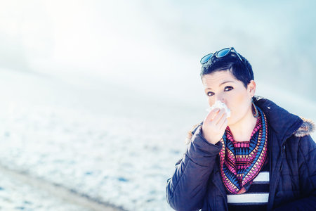 woman with handkerchiefs in hand.