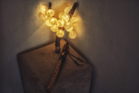 lamp with balls on woden stand and indian flute.