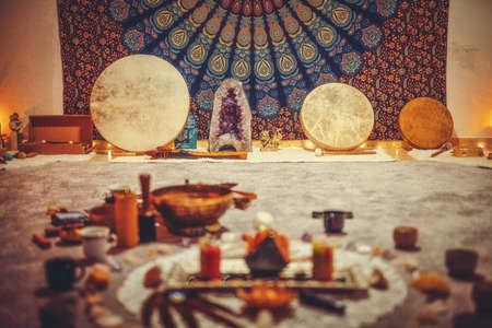 beautiful tibetan bowl and candles, ceremonial space.の写真素材