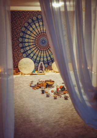 beautiful tibetan bowl and candles, ceremonial space.