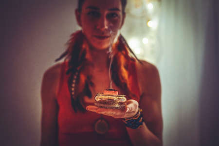 incense in a woman hand, ceremony space.の写真素材
