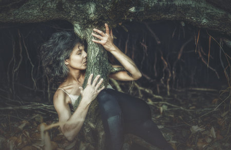 Sexy woman as a part of tree.の写真素材