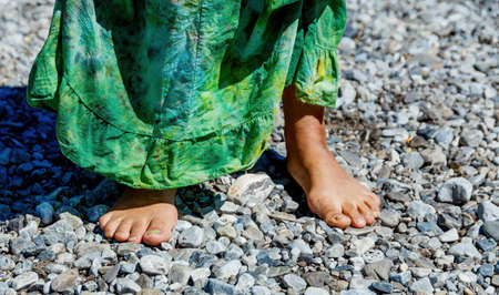 Female feet on the seashore.の写真素材