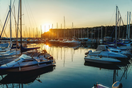 Sea bay with yachts at summer sunset.