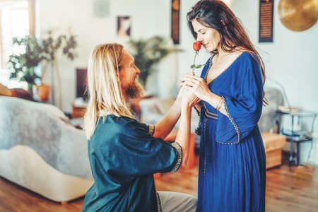 roamntic man with beautiful red roses in his hand.の写真素材