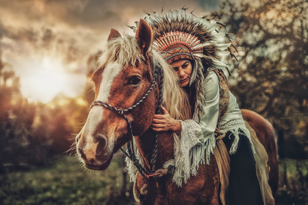 Shaman woman in landscape with her horse.
