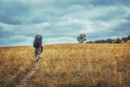 Paragliding in the mountains, paraglider on the ground.の写真素材
