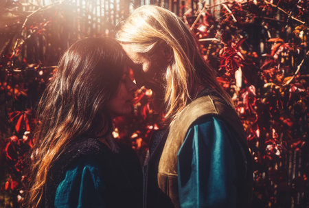 medieval man with beautiful medieval woman standing outdoor.の写真素材