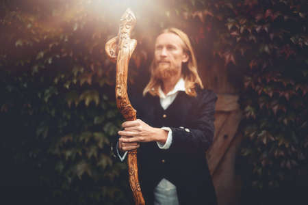 Alchemist in a beautiful ornamental dress in nature.の写真素材