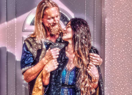 medieval man with beautiful medieval woman standing outdoor. Painting effect.の写真素材