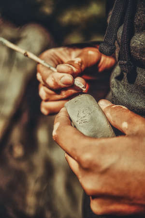 skilled hands of potter shaping the clay.の写真素材