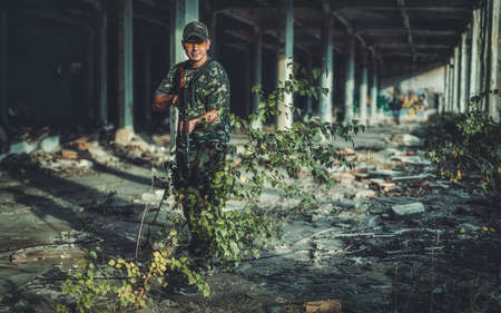 Airsoft soldier in the old industry building.の写真素材