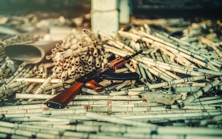 assault rifles on the ground.