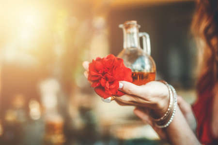 young beautiful woman with rose flowers in her hands.の写真素材