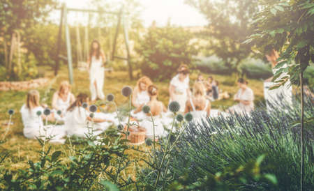 View of women making wreaths with beautiful flowers.の写真素材