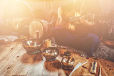 A still life of the shamanic drum and tibetan singing bowls.の写真素材