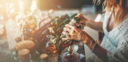 incense in a woman hand, ceremony space.の写真素材