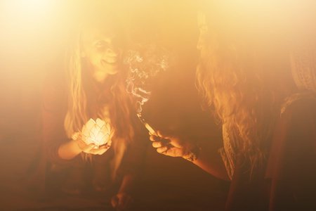 incense in a woman hand, ceremony space.の写真素材