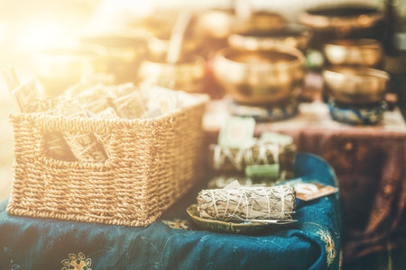 bunch of white sage on the table, Tibetan capes in the background.の写真素材