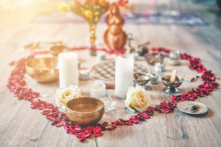 Beautiful altar with rose petals and goddess statuette. ceremony space.