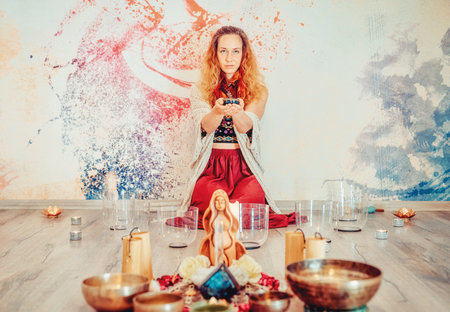 soundhealing, beautiful woman playing crystal bowls on cacao ceremony.