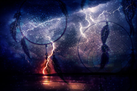Night storm and lightning in the clouds and dreamcatcher. Digital art.