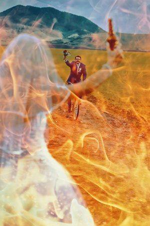 bride with a beer bottle and a groom on bicycle on the background - wedding concept. Fire effect.