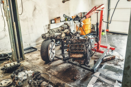 disassemble the engine from the car in the car workshop.の写真素材