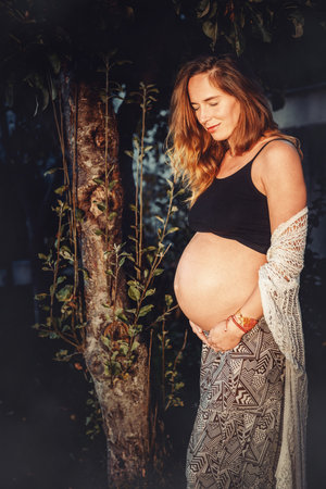 beautiful pregnant woman in nature.の写真素材