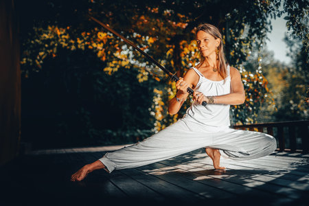 woman practicing with a sword.の写真素材
