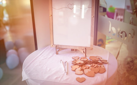 Wedding board for wedding wishes written on wooden hearts.の写真素材