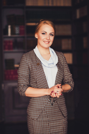 Successful business woman smiling and looking at cameraの写真素材