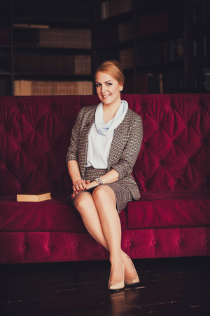 young beautiful successful woman sitting in the office.の写真素材
