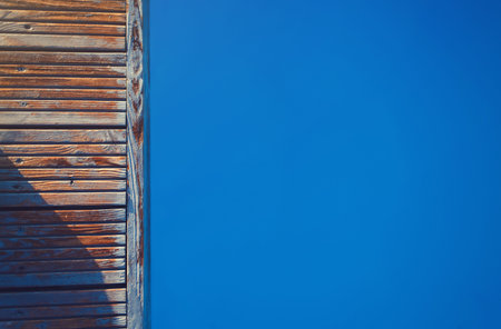 Pool with blue water and wooden texture. Places for text