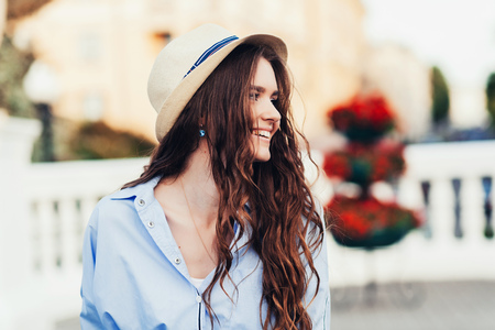 beautiful happy girl with hat outdoorsの写真素材