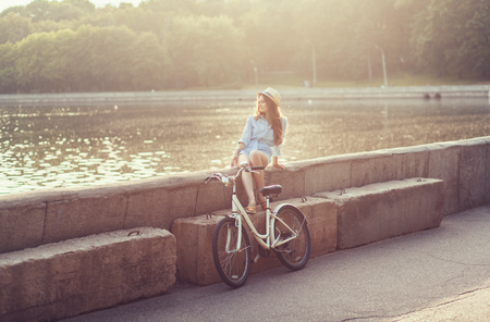 Young woman with bike enjoy summer vacationの写真素材