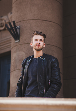 handsome fashionable man in black leather jacketの写真素材