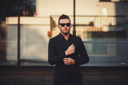 Elegant young handsome man outdoor. Fashion portrait.の写真素材